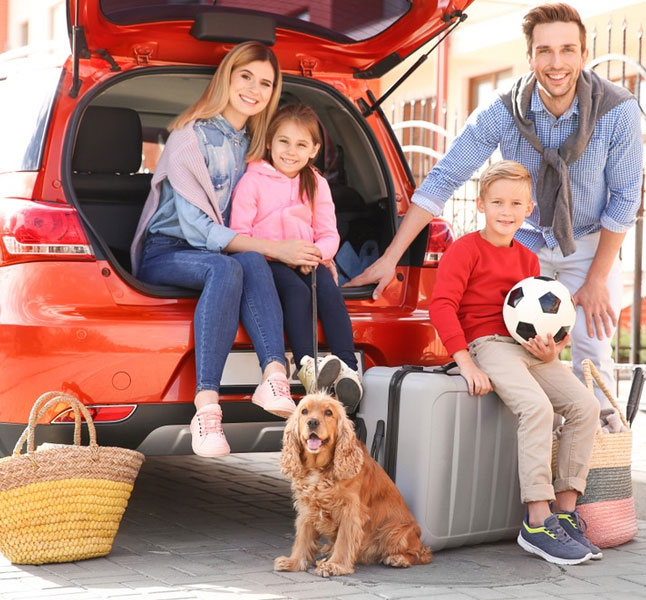 A happy family ready to go on family vacation in a limo service